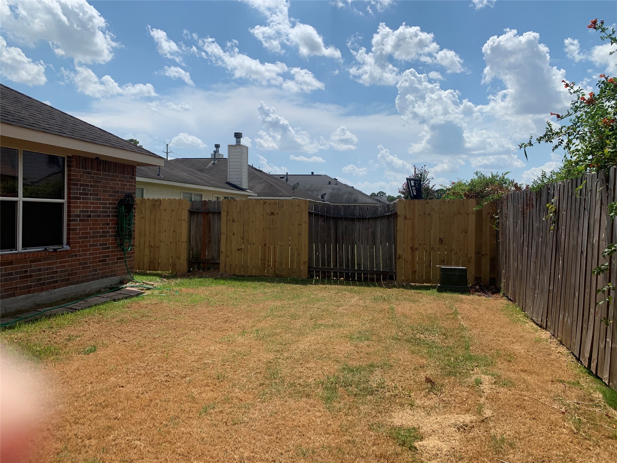 8823 Old Maple Lane Humble, TX 77338 - Photo 13 of 13 a backyard of a house with wooden fence