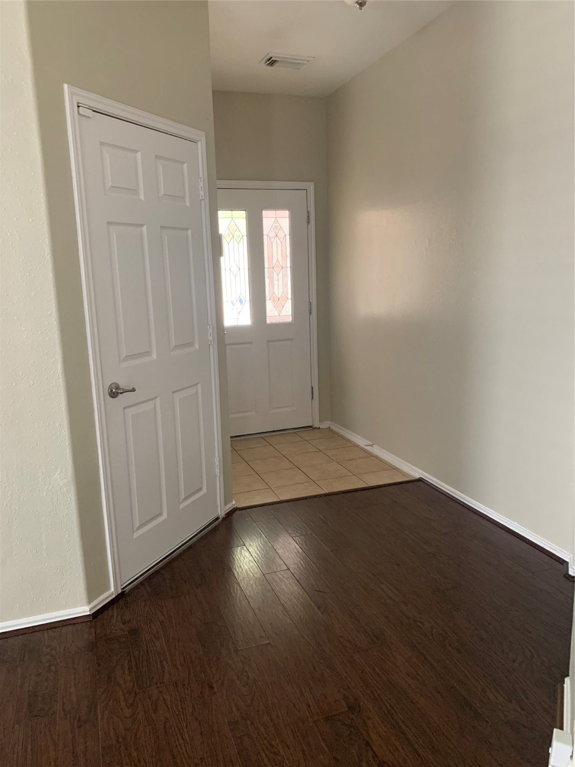 8823 Old Maple Lane Humble, TX 77338 - Photo 2 of 13 an empty room with wooden floor and windows