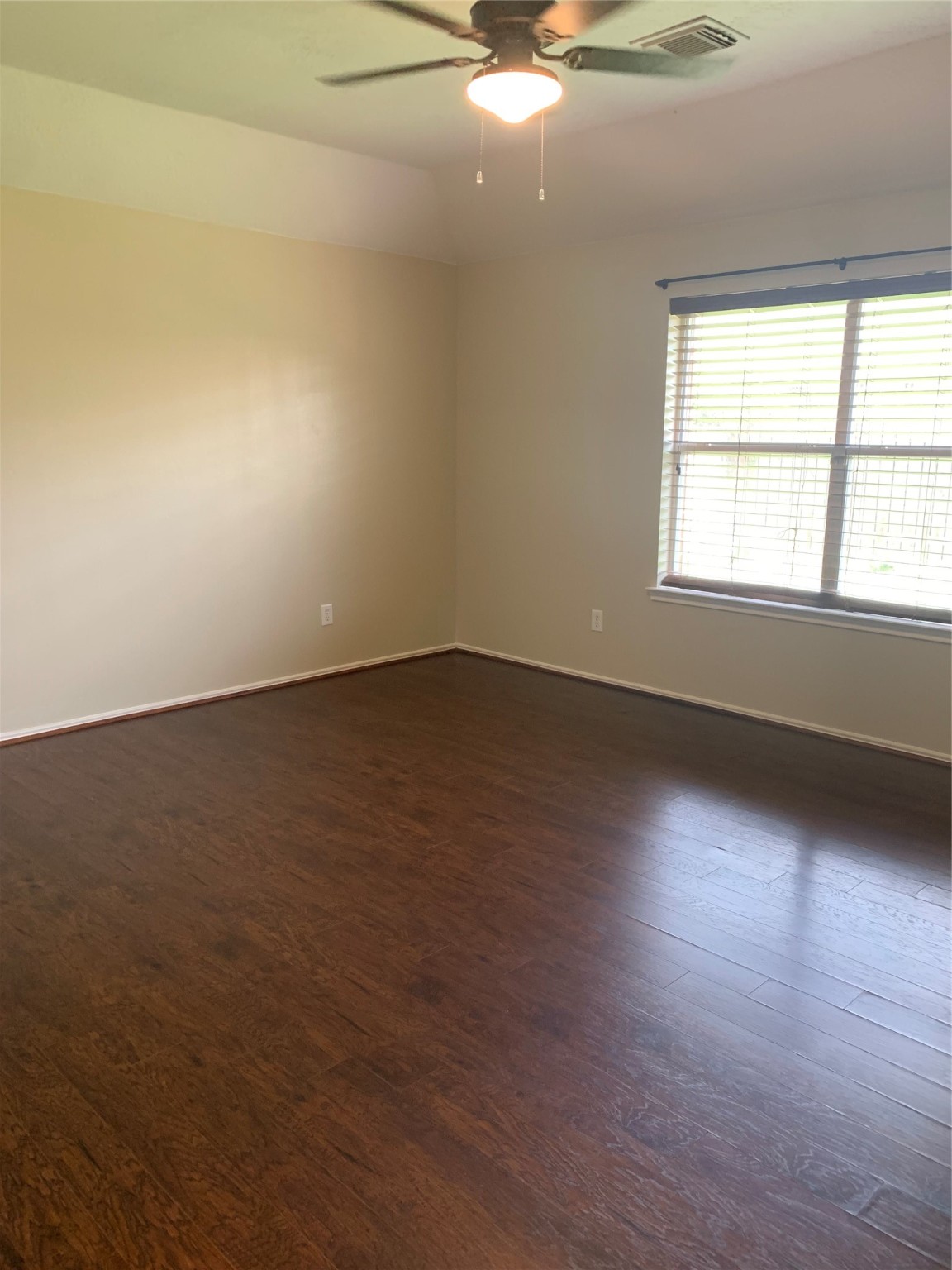8823 Old Maple Lane Humble, TX 77338 - Photo 8 of 13 an empty room with wooden floor and windows