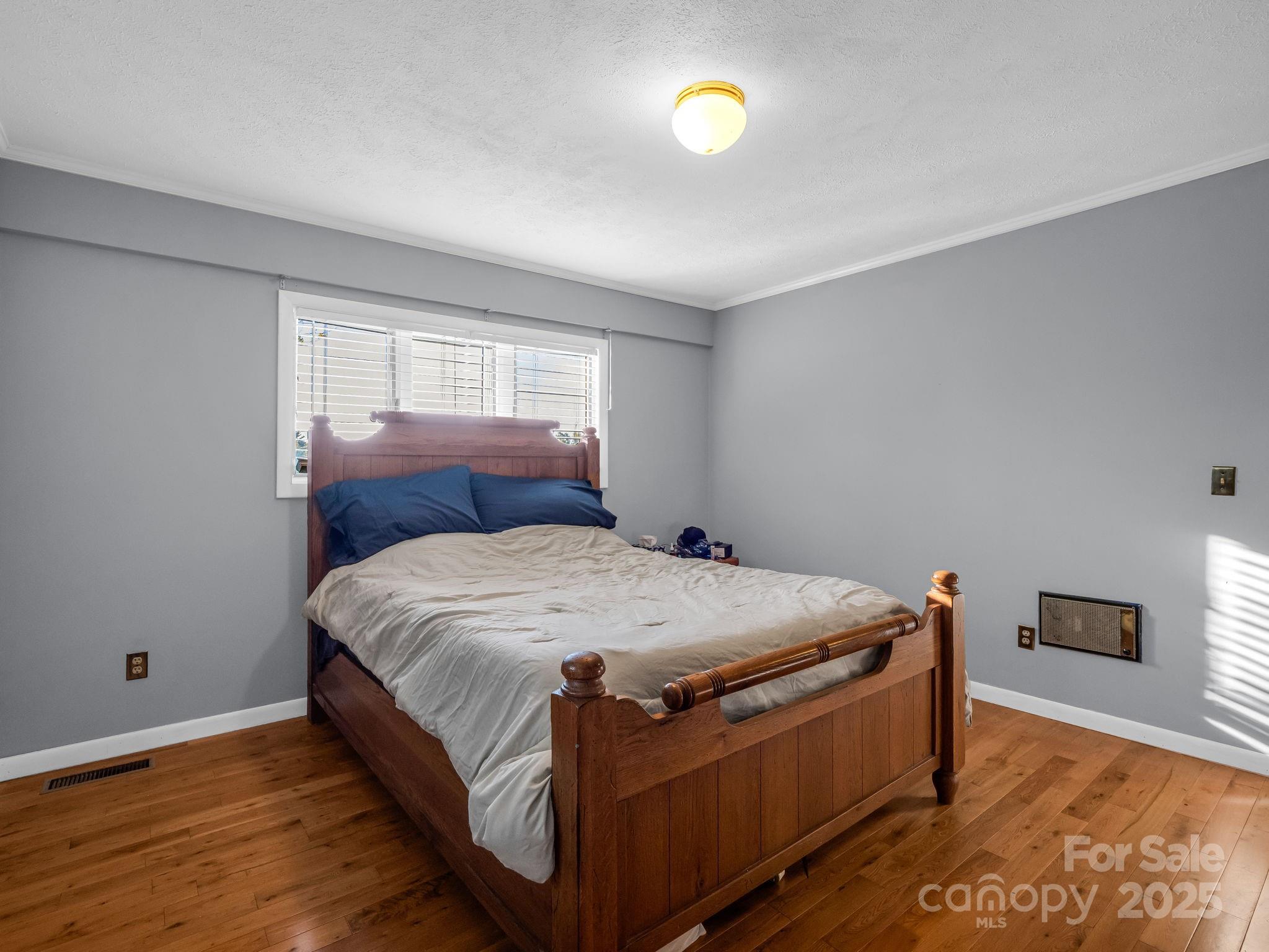 290 Stepp Mill Road Hendersonville, NC 28792 - Photo 14 of 29 a bedroom with a bed and a window