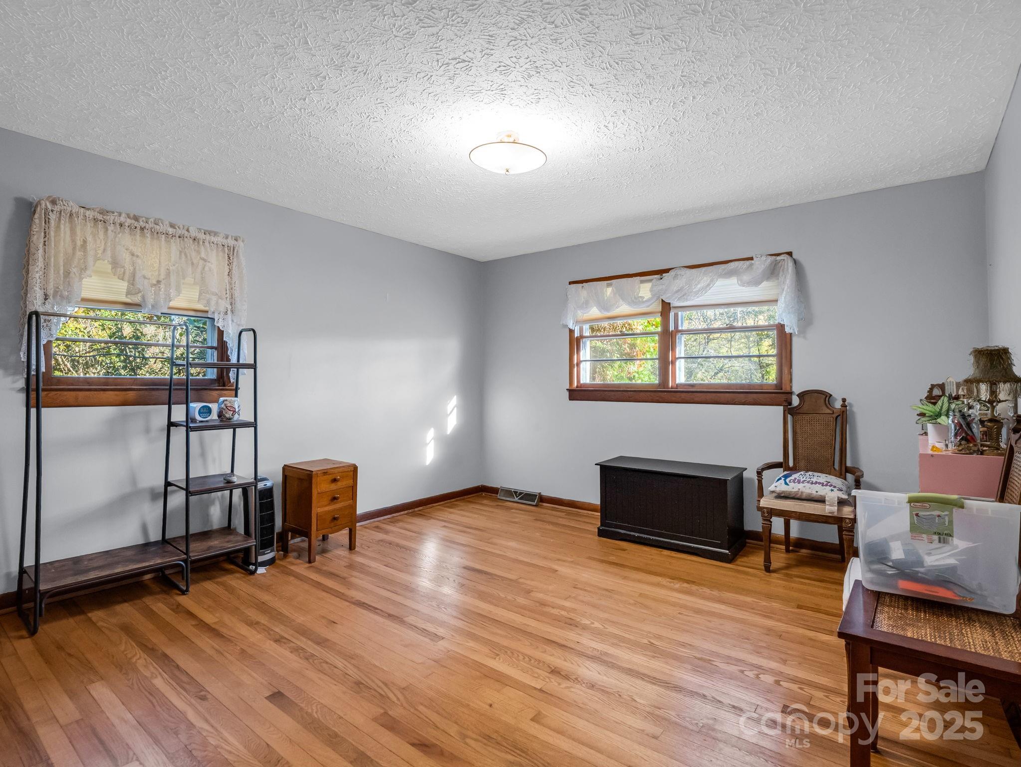 290 Stepp Mill Road Hendersonville, NC 28792 - Photo 17 of 29 a workspace with furniture window and wooden floor