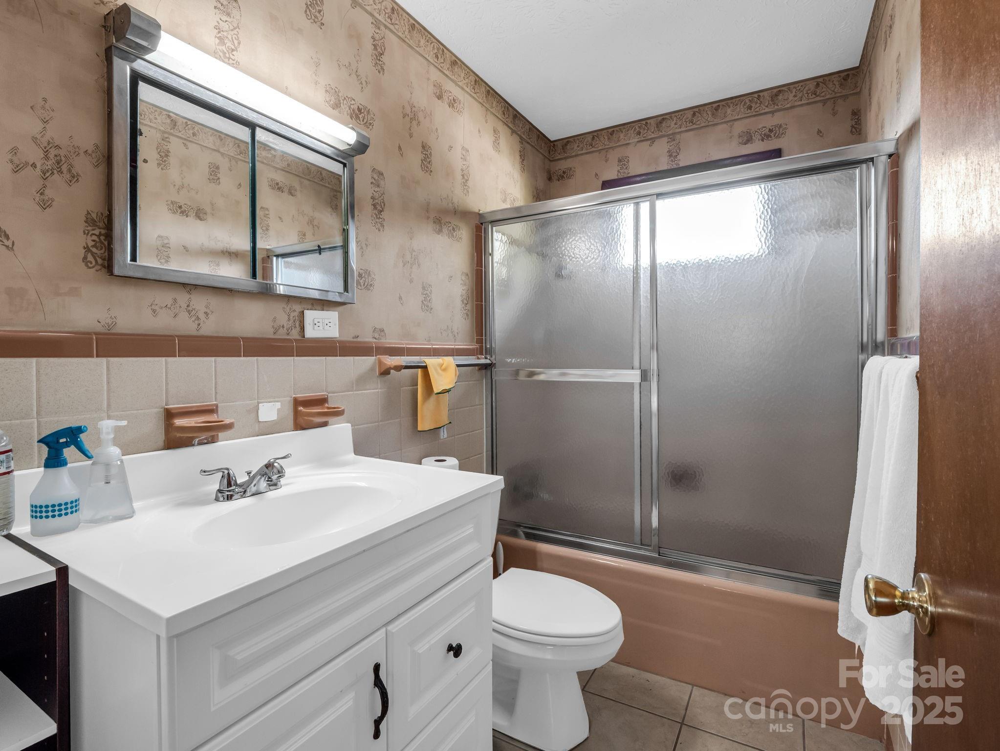 290 Stepp Mill Road Hendersonville, NC 28792 - Photo 19 of 29 a bathroom with a sink toilet and shower