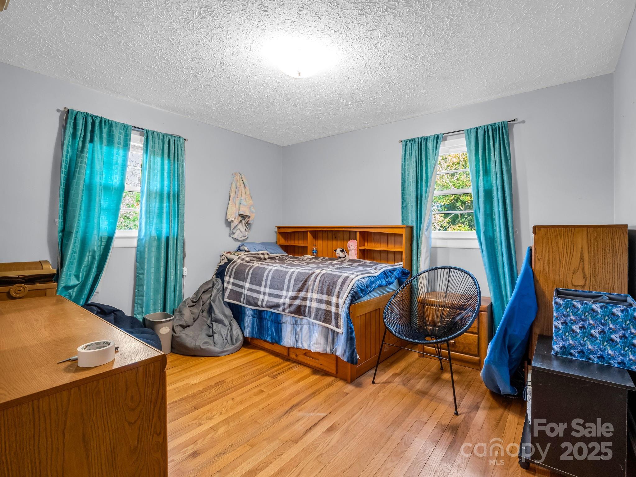 290 Stepp Mill Road Hendersonville, NC 28792 - Photo 20 of 29 a bedroom with a bed and window