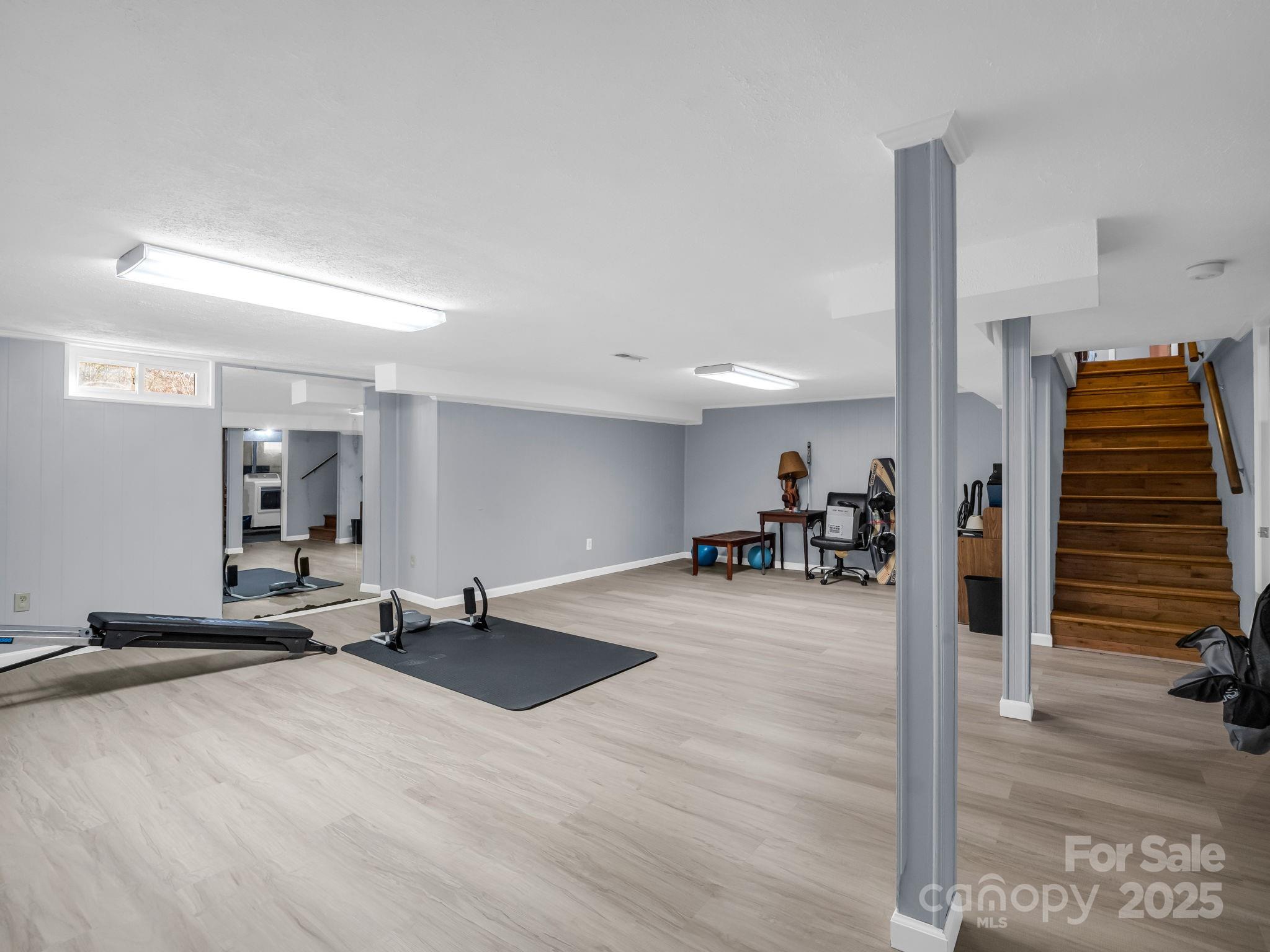 290 Stepp Mill Road Hendersonville, NC 28792 - Photo 22 of 29 a view of a room with gym equipment