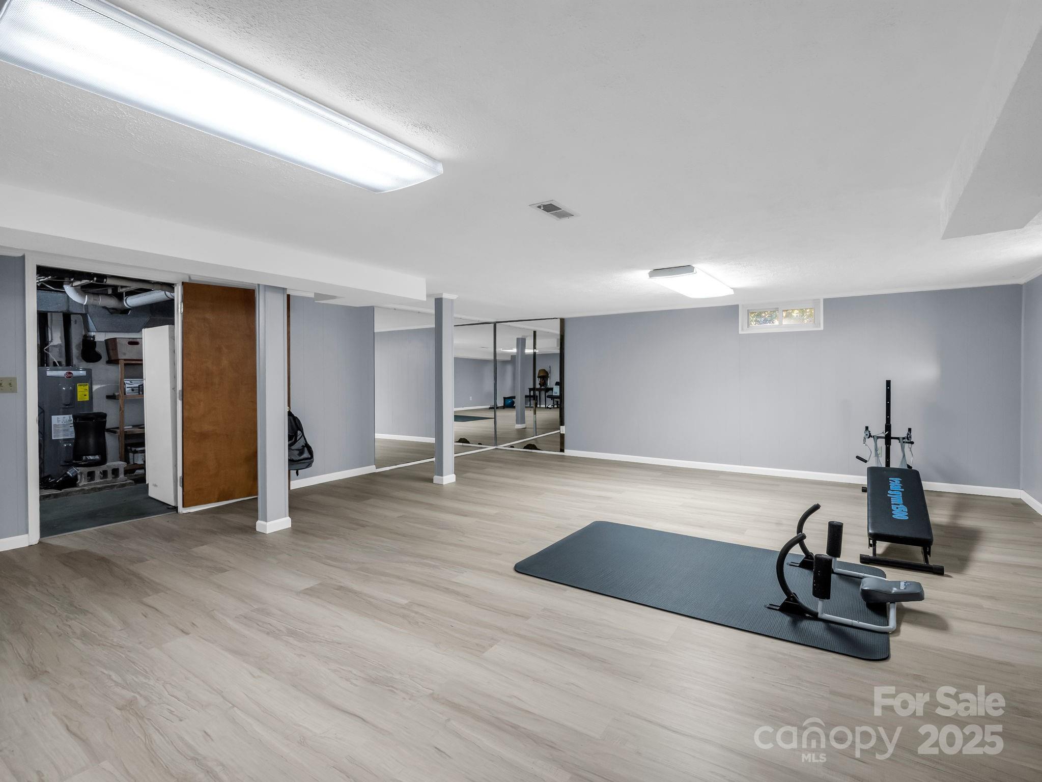 290 Stepp Mill Road Hendersonville, NC 28792 - Photo 23 of 29 a view of a room with gym equipment