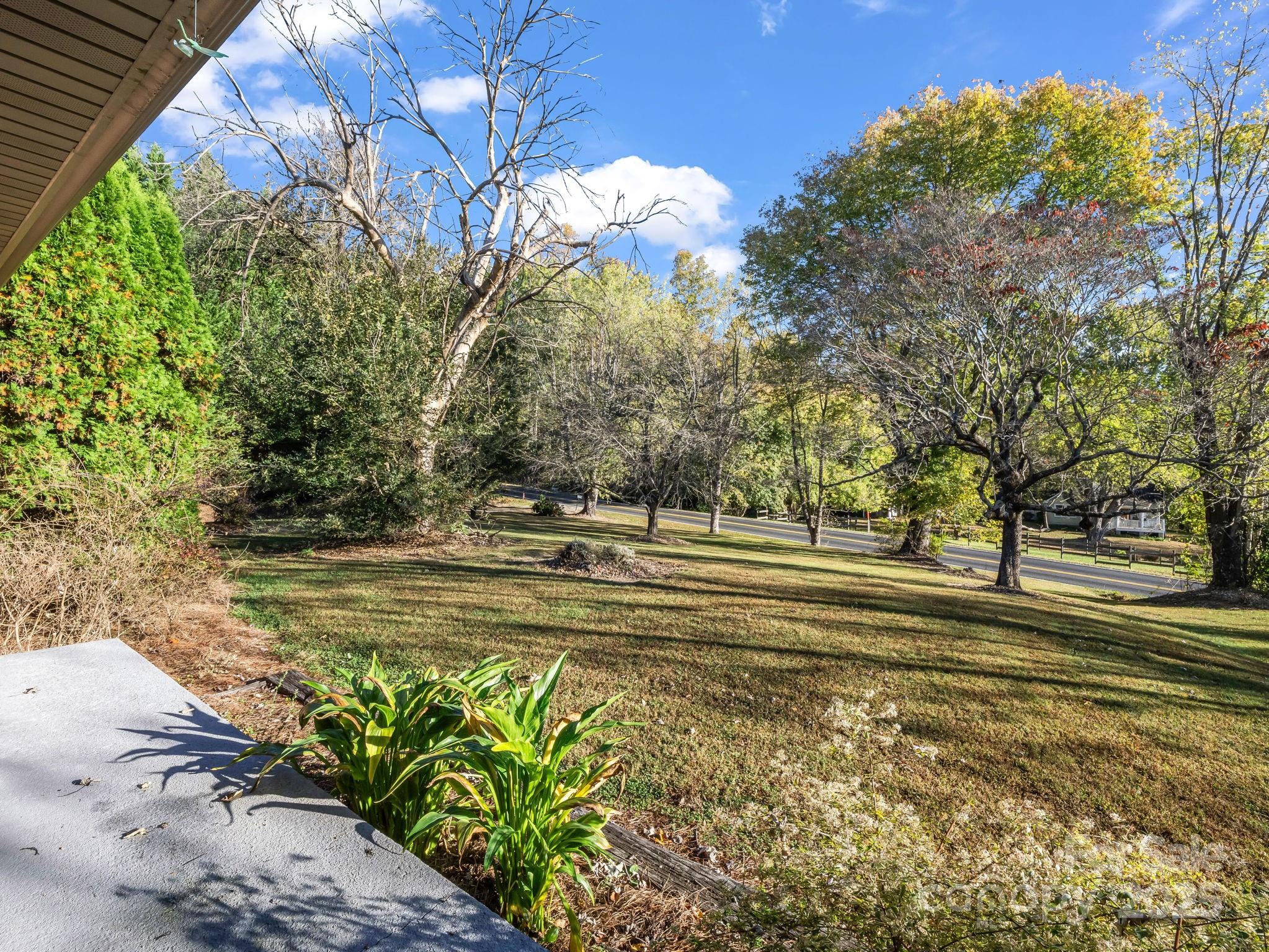 290 Stepp Mill Road Hendersonville, NC 28792 - Photo 25 of 29 a view of a house with a yard