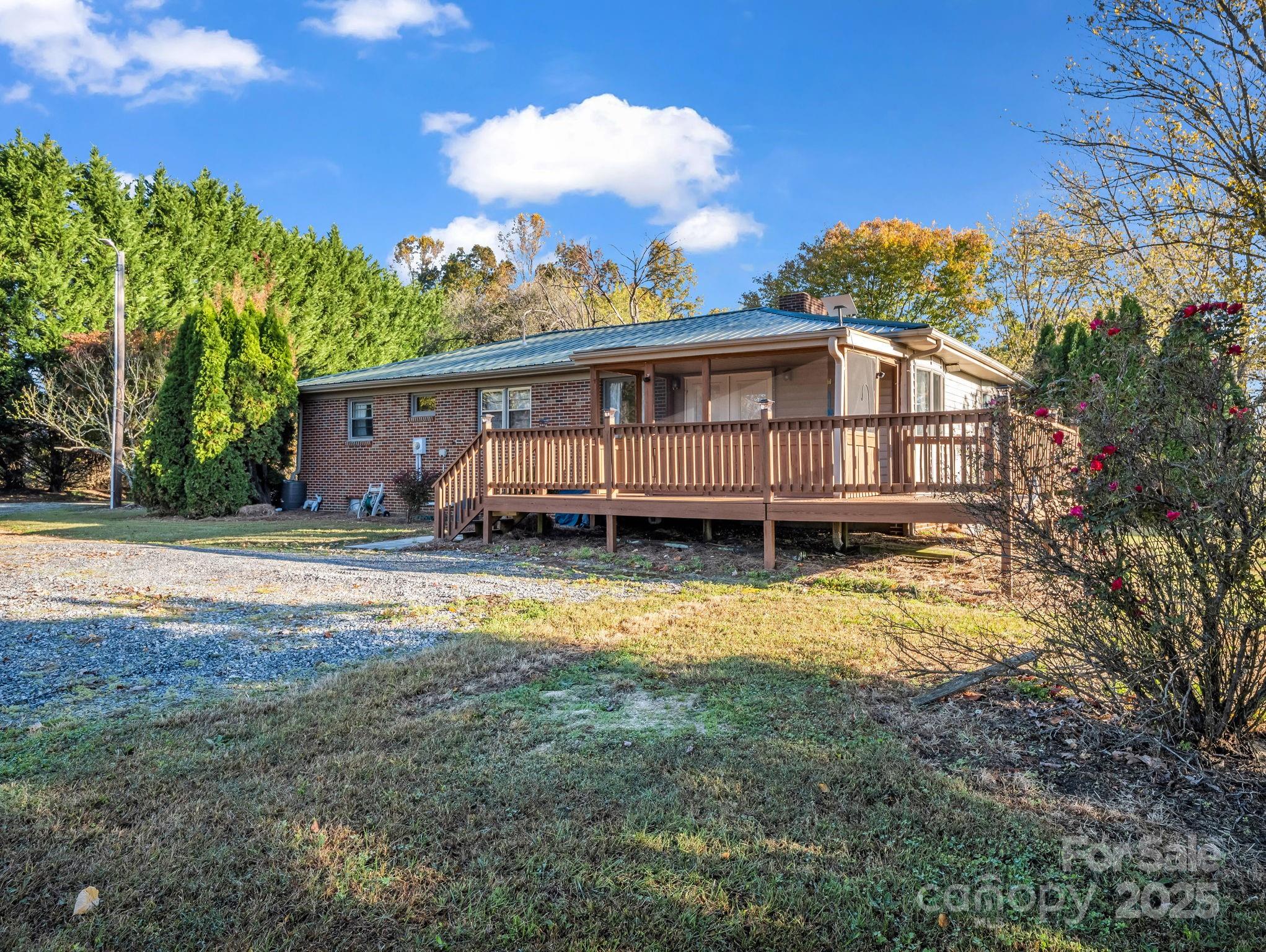 290 Stepp Mill Road Hendersonville, NC 28792 - Photo 3 of 29 a view of a house with backyard and sitting area