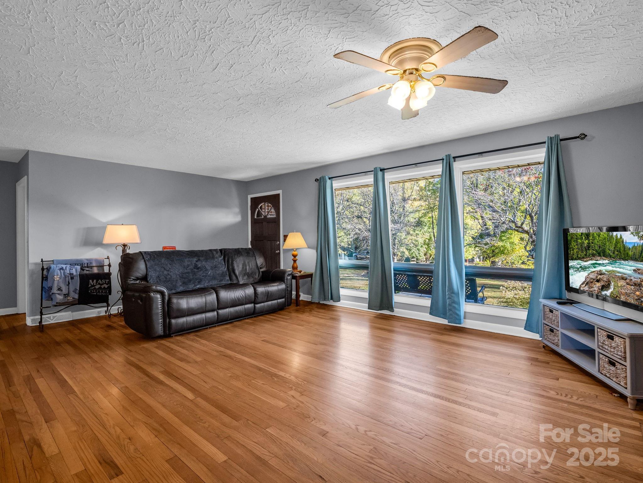 290 Stepp Mill Road Hendersonville, NC 28792 - Photo 6 of 29 a living room with furniture and a large window