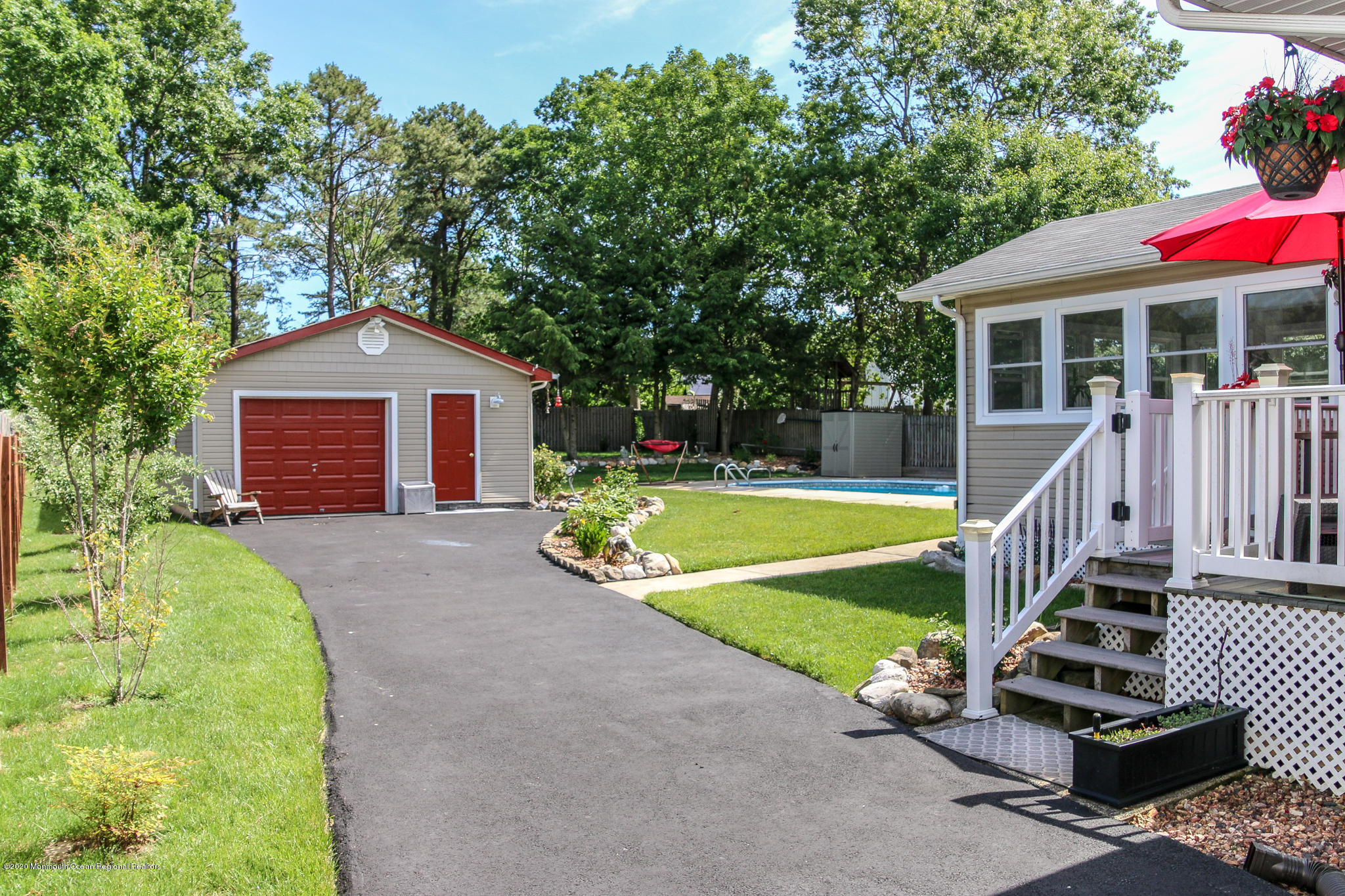 220 Wave Road Manahawkin, NJ 08050 - Photo 12 of 87 a view of a house with a yard patio and a small yard