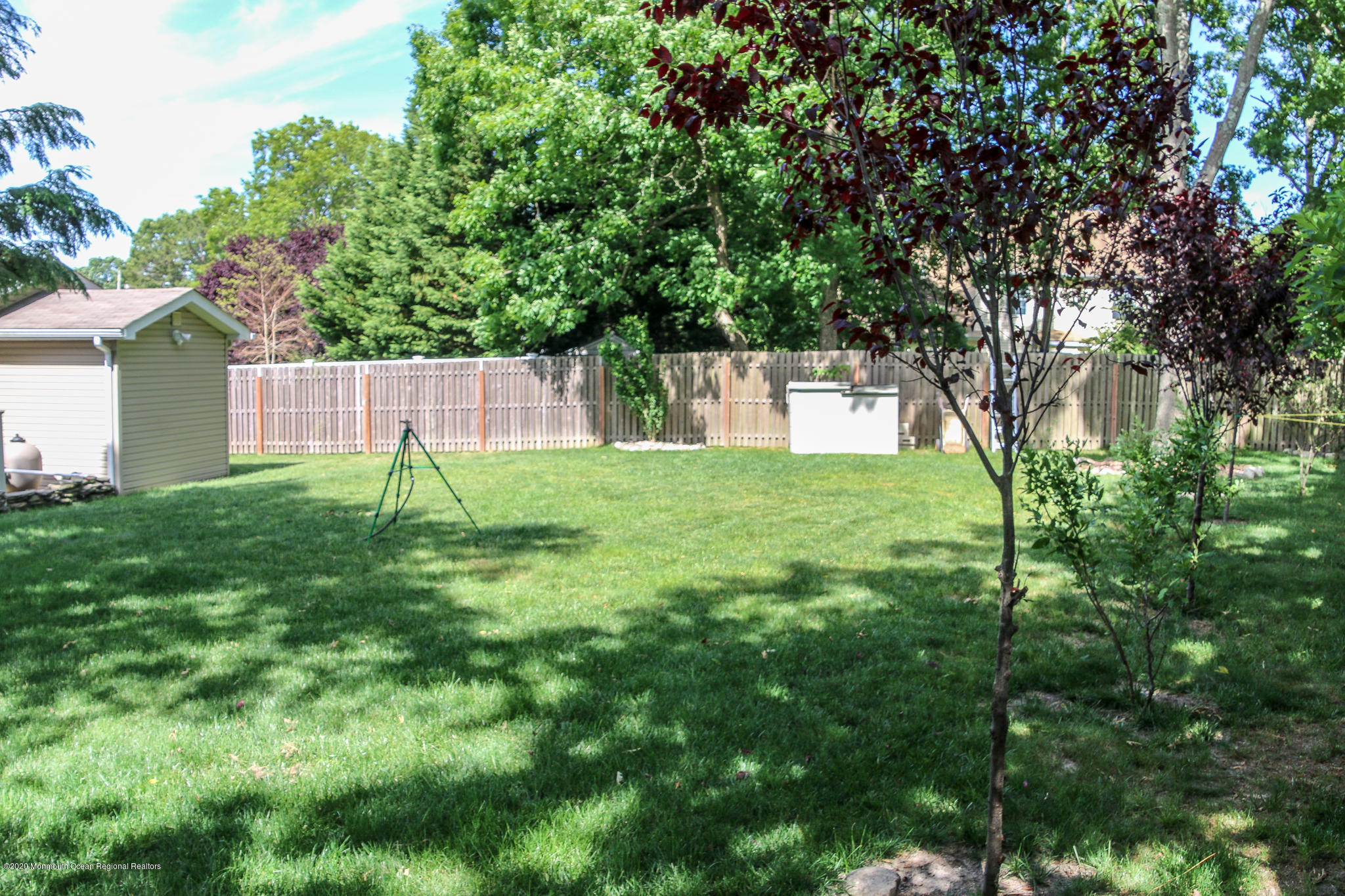 220 Wave Road Manahawkin, NJ 08050 - Photo 23 of 87 a view of backyard with a barn and large trees