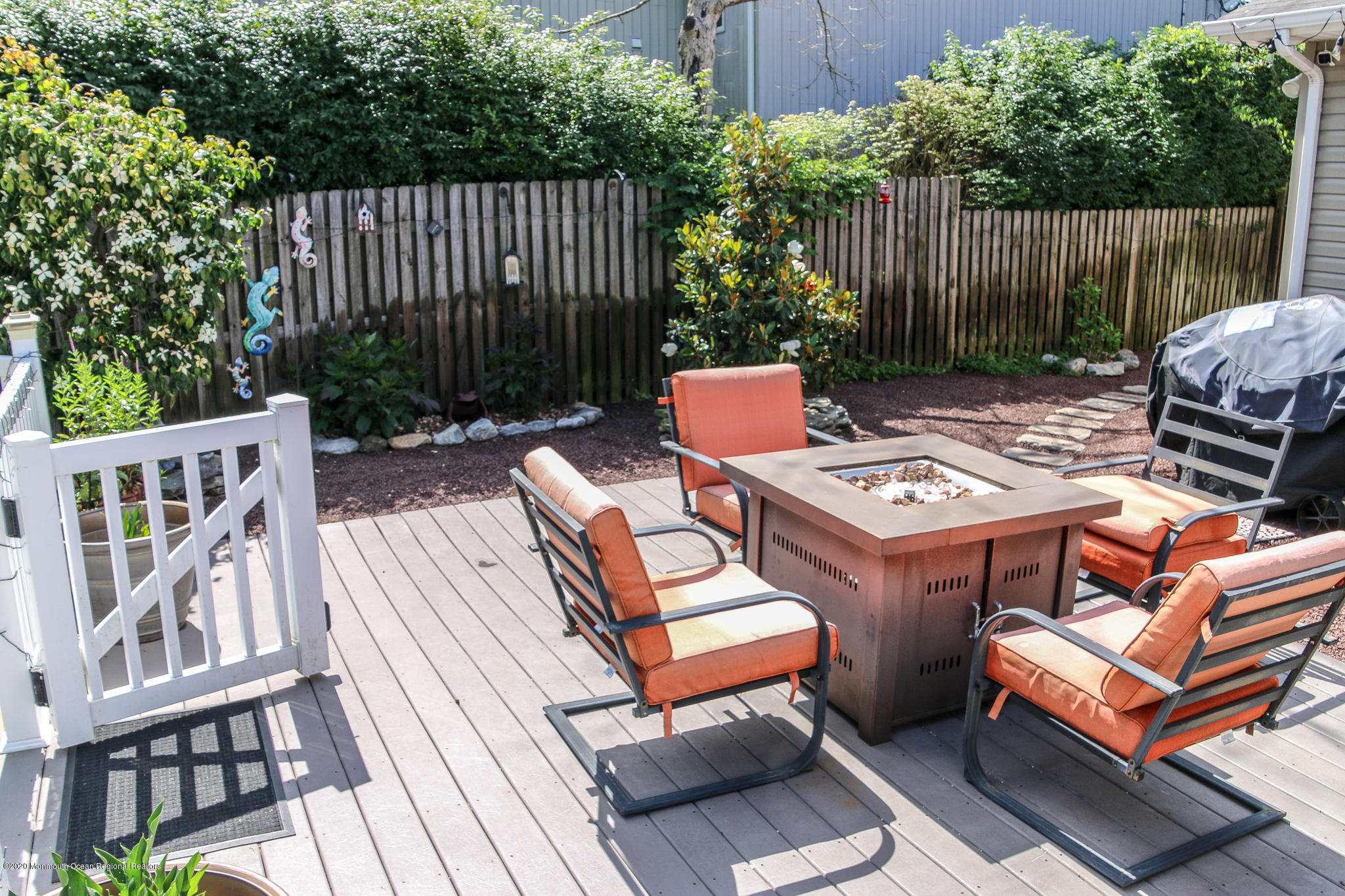 220 Wave Road Manahawkin, NJ 08050 - Photo 30 of 87 a backyard of a house with a seating space