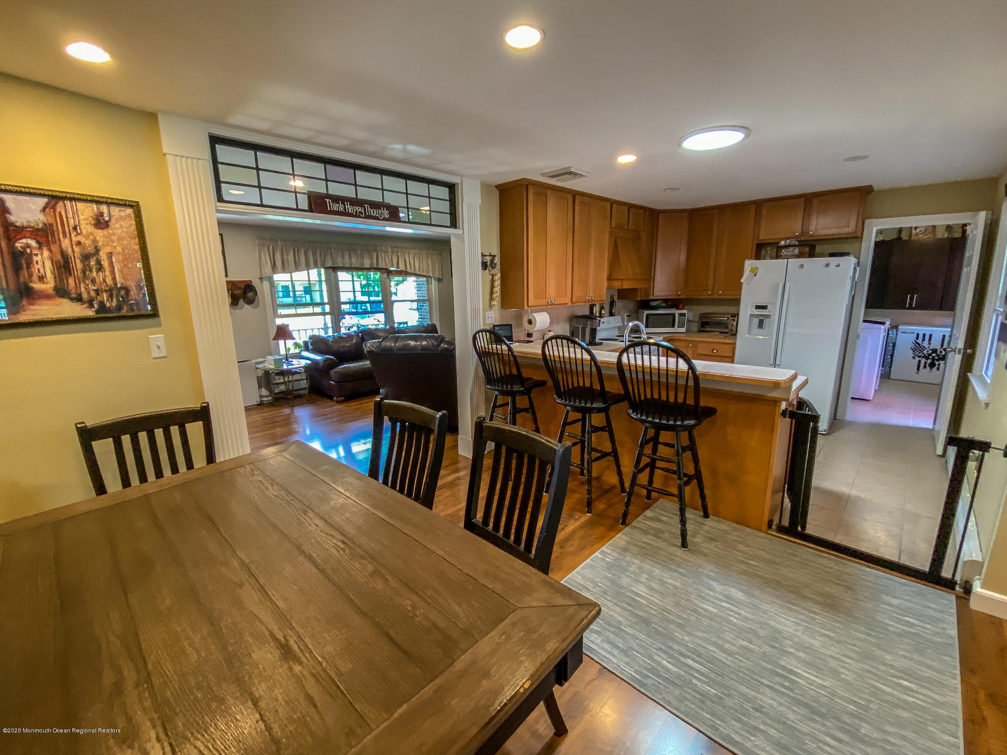 220 Wave Road Manahawkin, NJ 08050 - Photo 43 of 87 a view of a dining room with furniture window and wooden floor