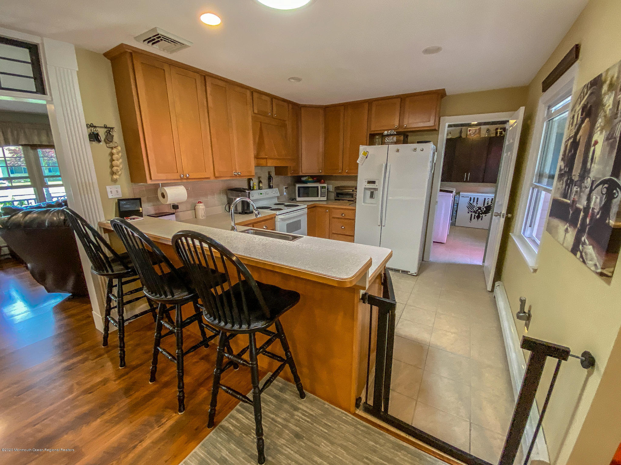 220 Wave Road Manahawkin, NJ 08050 - Photo 45 of 87 a view of a dining room with furniture and a refrigerator