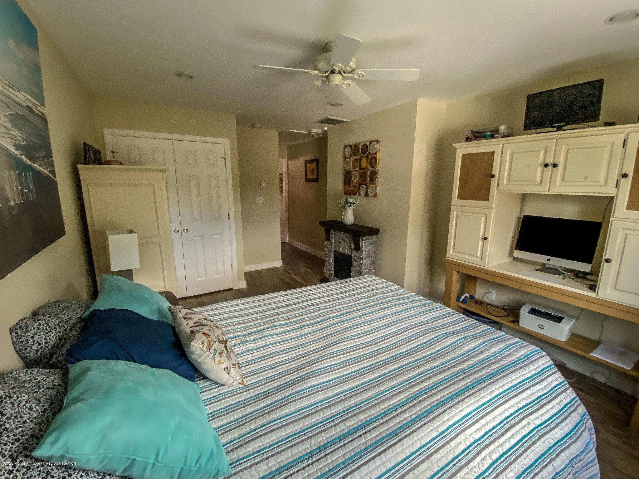 220 Wave Road Manahawkin, NJ 08050 - Photo 54 of 87 a bedroom with a bed and a flat screen tv