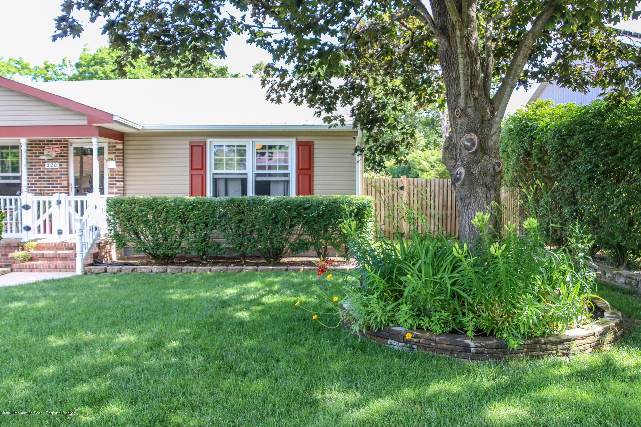 220 Wave Road Manahawkin, NJ 08050 - Photo 6 of 87 a view of a house with a yard and sitting area