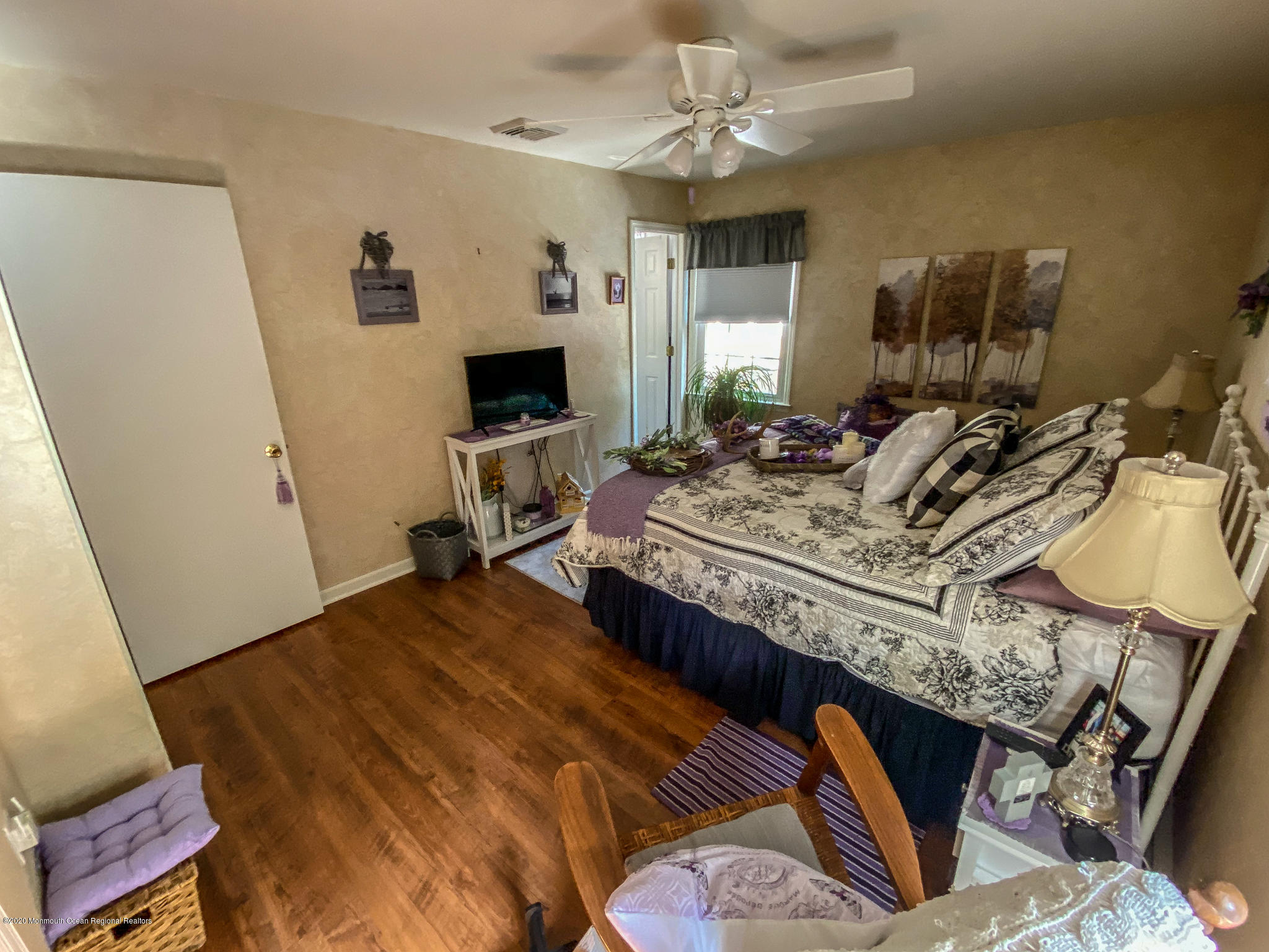 220 Wave Road Manahawkin, NJ 08050 - Photo 72 of 87 a bedroom with a bed a flat screen tv and a dresser