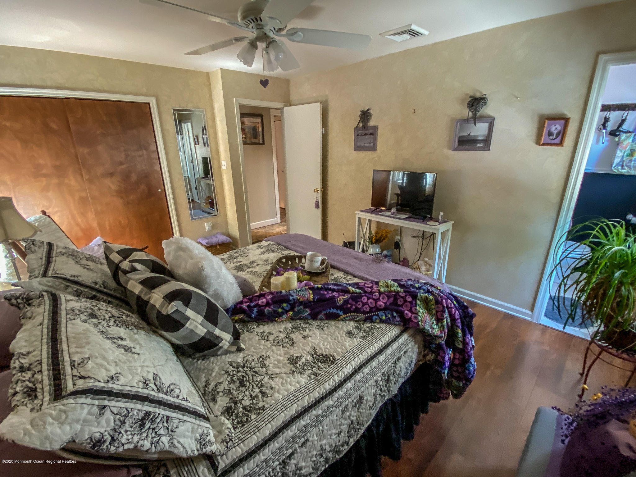 220 Wave Road Manahawkin, NJ 08050 - Photo 74 of 87 a bedroom with a bed and a flat screen tv