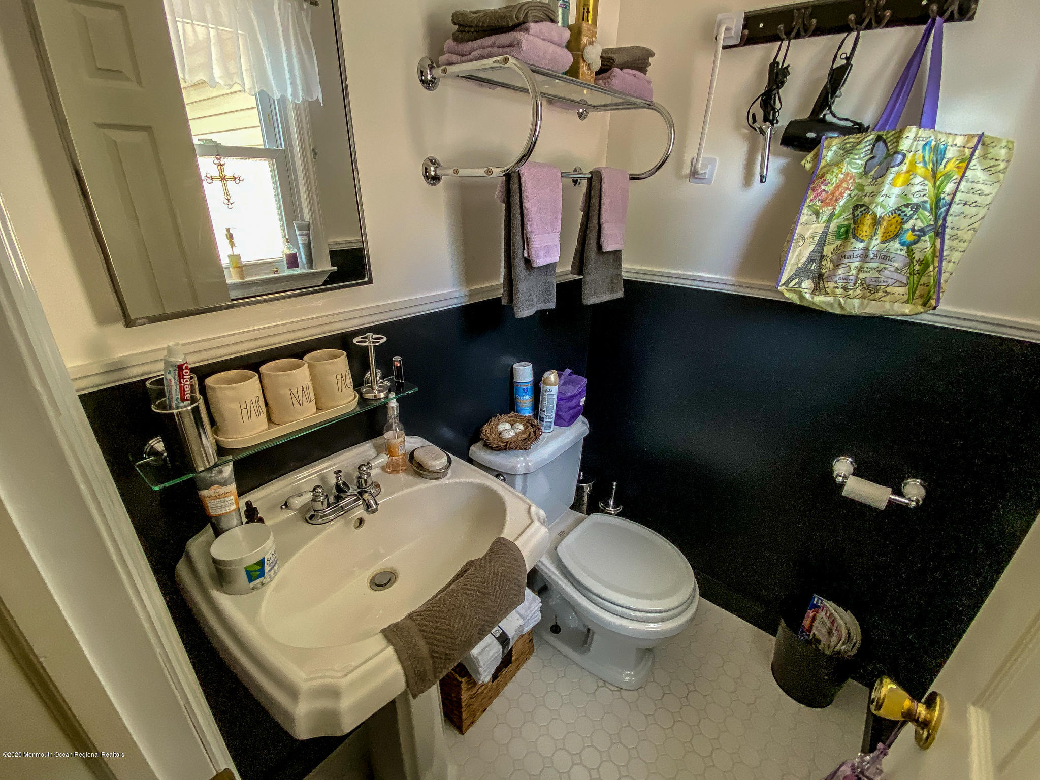 220 Wave Road Manahawkin, NJ 08050 - Photo 76 of 87 a bathroom with a sink toilet and a mirror