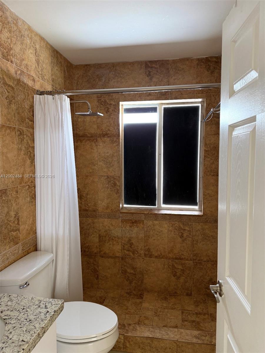17501 Southwest 142nd Court Miami, FL 33177 - Photo 7 of 10 a bathroom with a toilet and a shower