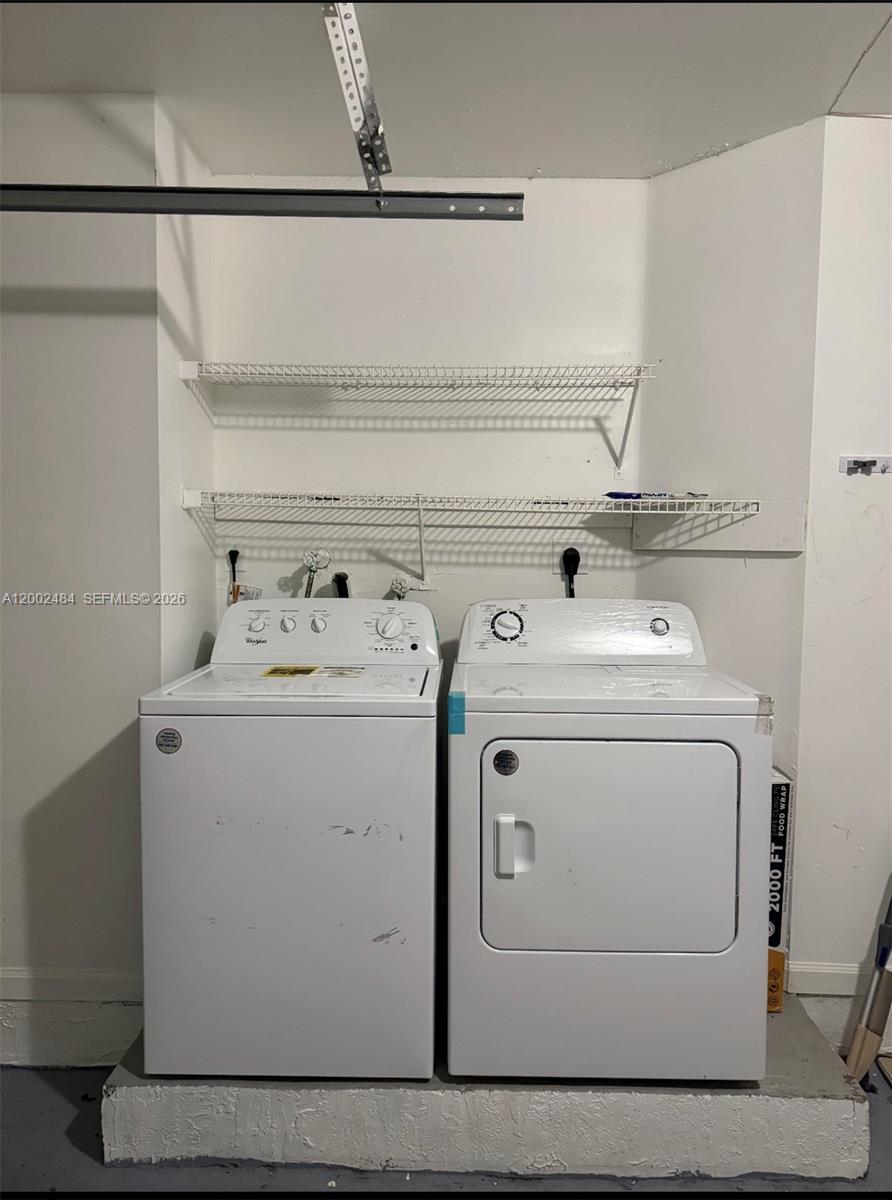 17501 Southwest 142nd Court Miami, FL 33177 - Photo 8 of 10 a utility room with dryer and washer