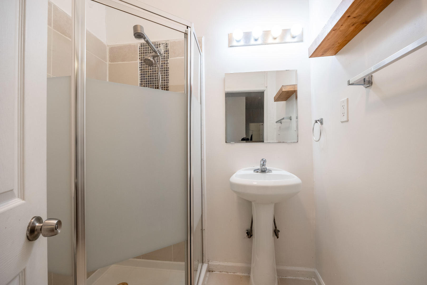1900 South Throop Street, Unit 9 Chicago, IL 60608 - Photo 11 of 11 a bathroom with a sink mirror and shower