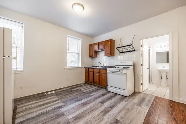 a kitchen with a stove and a refrigerator