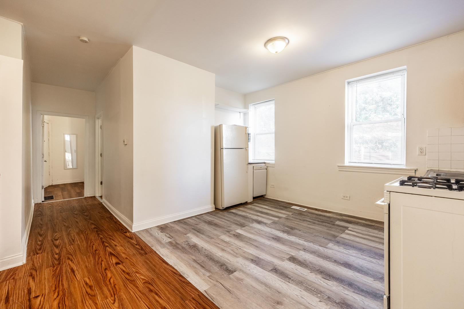 1900 South Throop Street, Unit 9 Chicago, IL 60608 - Photo 3 of 11 a view of a room with wooden floor and a window