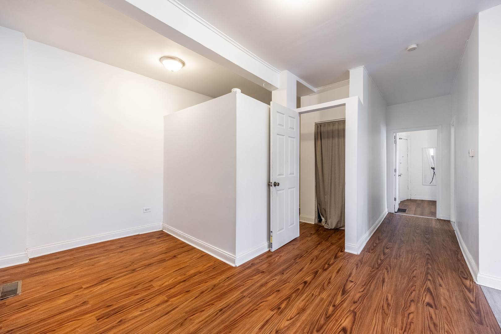 1900 South Throop Street, Unit 9 Chicago, IL 60608 - Photo 5 of 11 a view of hallway with wooden floor