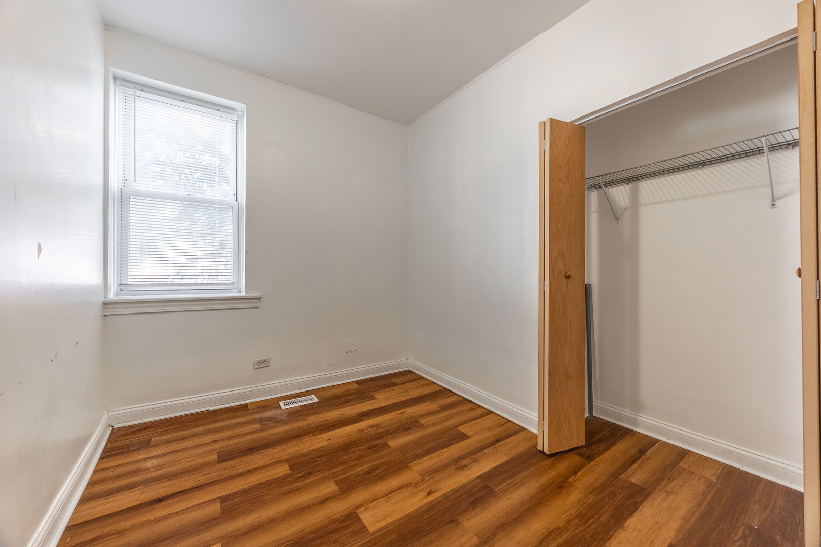 1900 South Throop Street, Unit 9 Chicago, IL 60608 - Photo 9 of 11 a view of room with window and hardwood floor