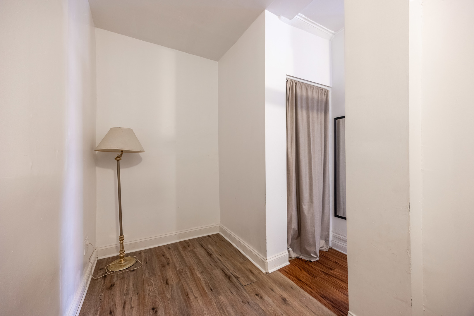 1900 South Throop Street, Unit 9 Chicago, IL 60608 - Photo 10 of 11 a view of a room with wooden floor and a table