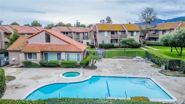 a front view of a house with yard and green space