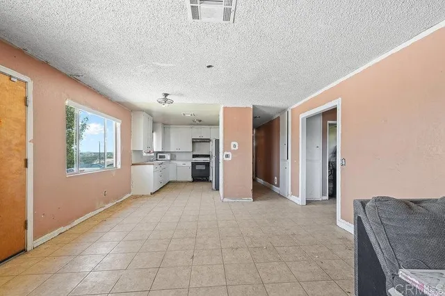 a view of a livingroom with furniture and windows