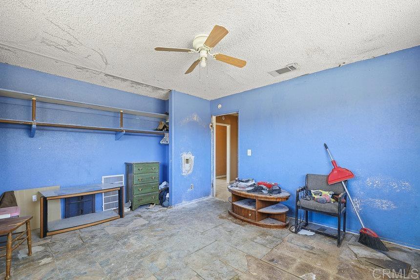 39635 Manzanita Dulce Road Boulevard, CA 91905 - Photo 14 of 33 a bed room with a bed and a window