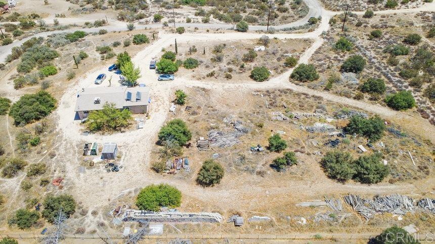39635 Manzanita Dulce Road Boulevard, CA 91905 - Photo 23 of 33 a view of a dry yard with wooden fence