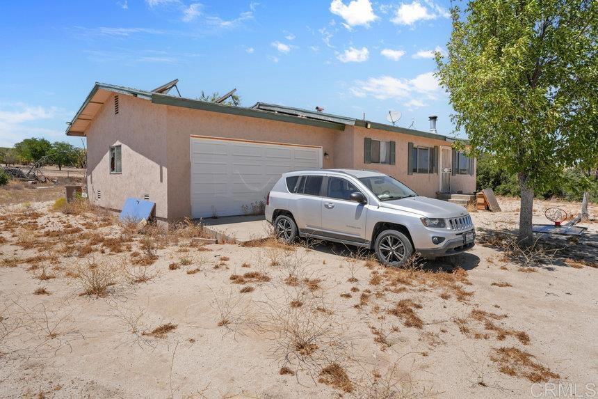 39635 Manzanita Dulce Road Boulevard, CA 91905 - Photo 29 of 33 a view of a car in front of a house