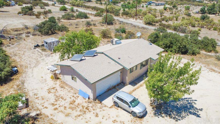 39635 Manzanita Dulce Road Boulevard, CA 91905 - Photo 3 of 33 an aerial view of a house with a yard and large trees