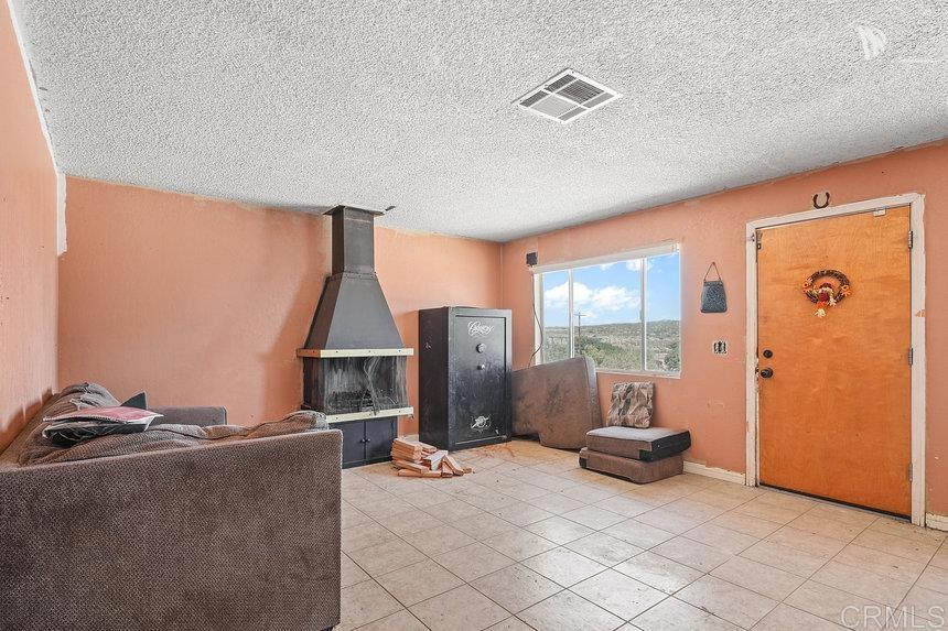 39635 Manzanita Dulce Road Boulevard, CA 91905 - Photo 4 of 33 a living room with furniture and a window