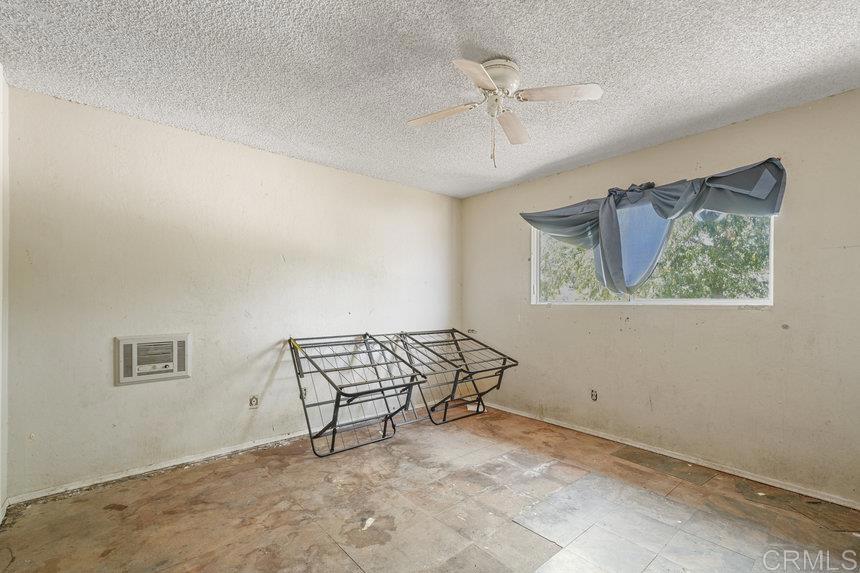 39635 Manzanita Dulce Road Boulevard, CA 91905 - Photo 9 of 33 a view of a room with wooden floor ceiling fan