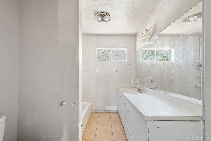39635 Manzanita Dulce Road Boulevard, CA 91905 - Photo 10 of 33 a view of a bathroom with sink and mirror
