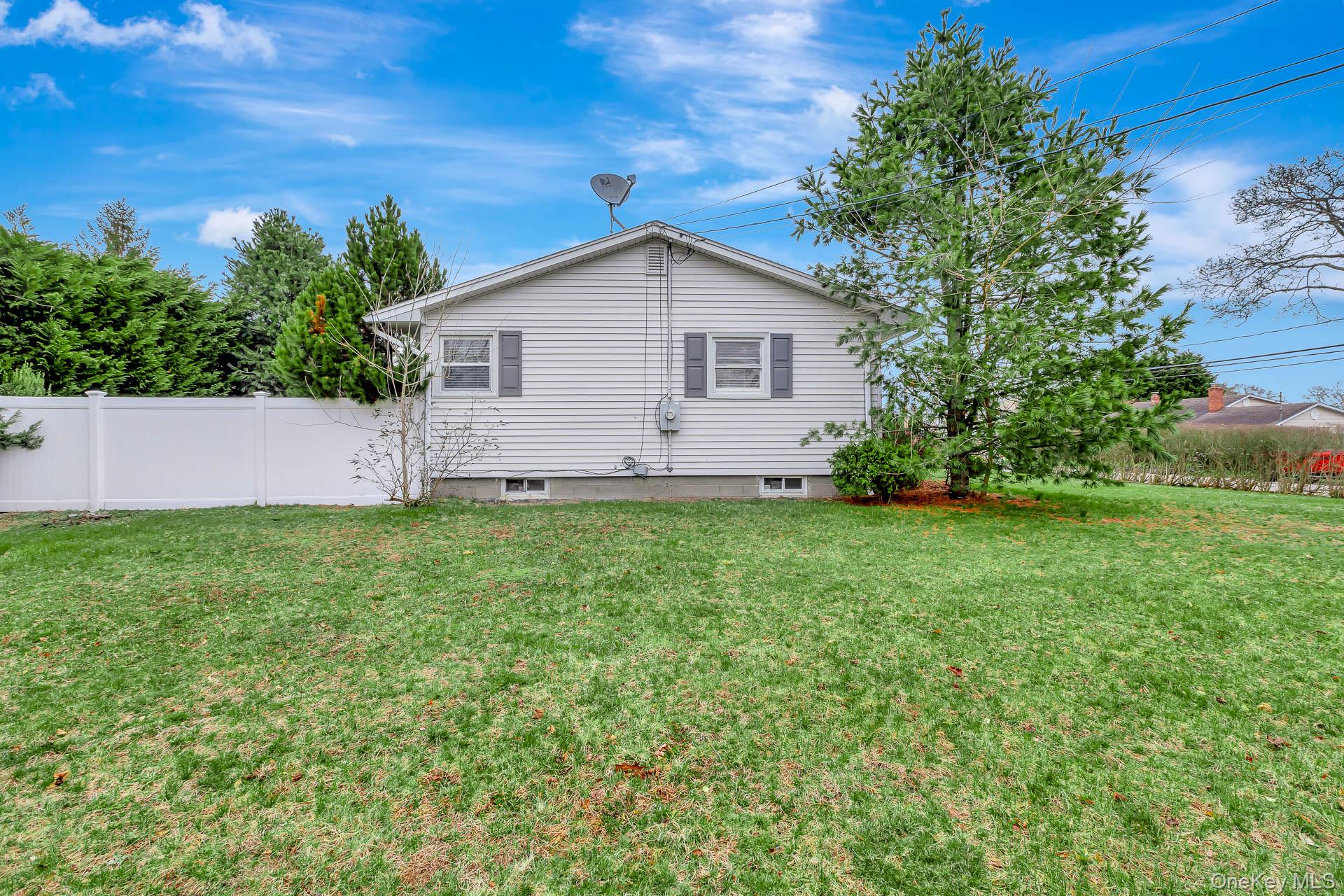 5 Richlee Street Blue Point, NY 11715 - Photo 22 of 27 a view of backyard with garden