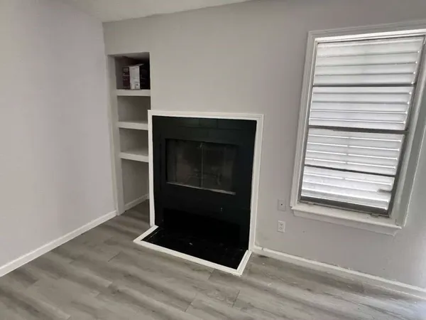 a view of a kitchen from a hallway