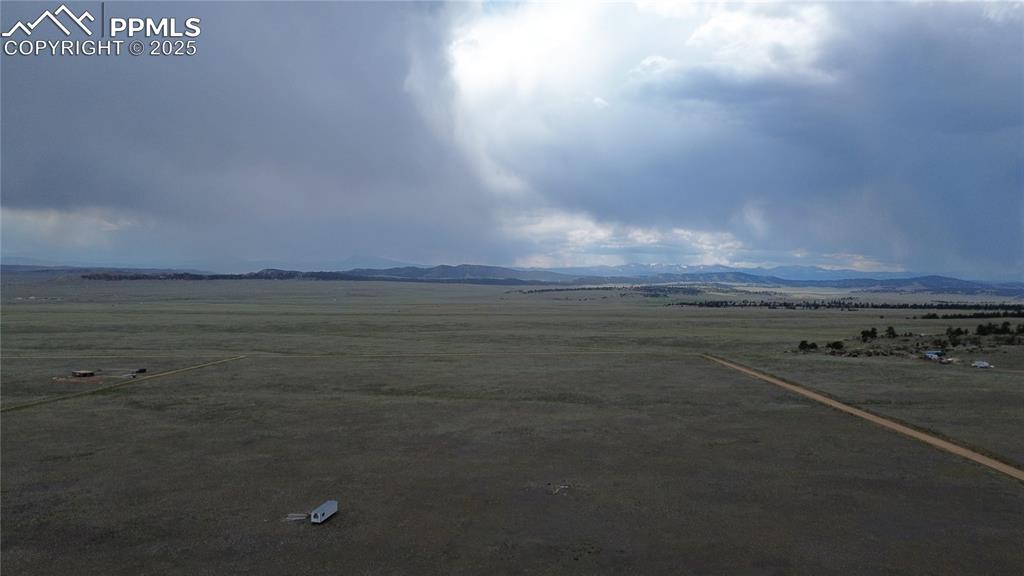6944 Jefferson Road Lake George, CO 80827 - Photo 3 of 8 Aerial view of sparsely populated area featuring a mountainous background