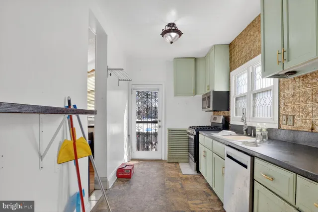 a kitchen that has a sink and a window