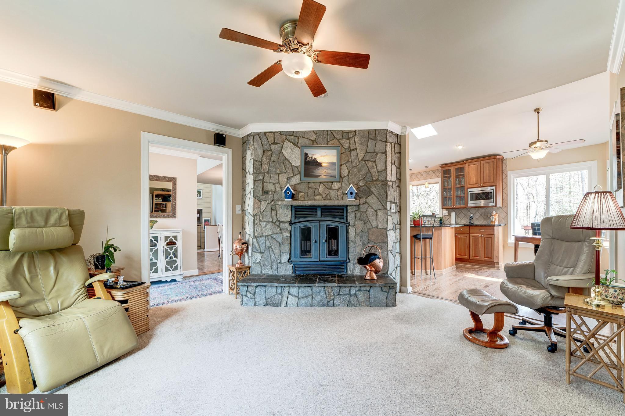 11108 Farm Road Great Falls, VA 22066 - Photo 12 of 58 Raised Hearth fireplace in family room w stone