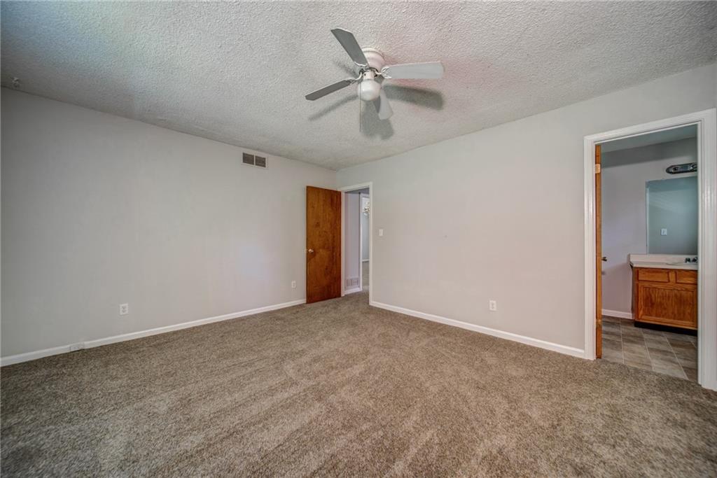 4355 East Paulding Drive, Unit A Dallas, GA 30157 - Photo 16 of 29 wooden floor in an empty room and a ceiling fan