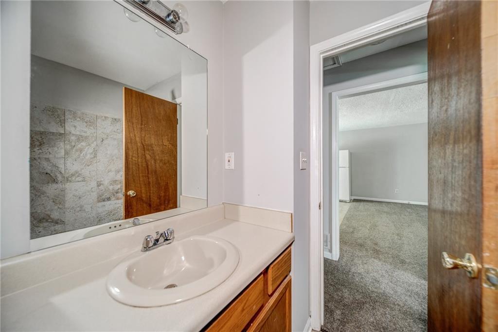 4355 East Paulding Drive, Unit A Dallas, GA 30157 - Photo 18 of 29 a bathroom with a sink and a mirror