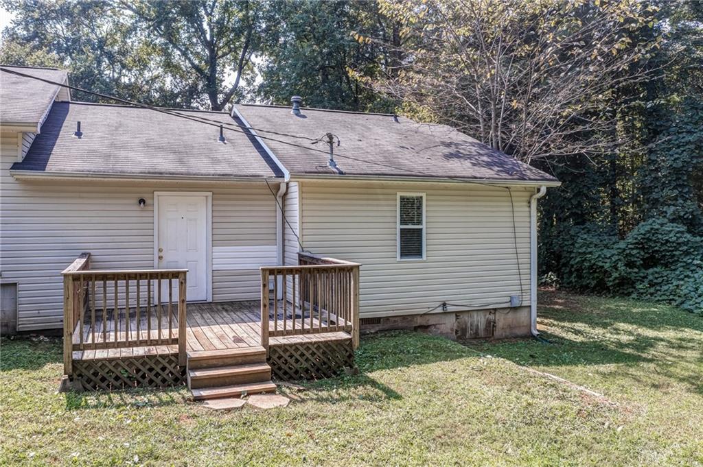 4355 East Paulding Drive, Unit A Dallas, GA 30157 - Photo 27 of 29 a view of a house with a yard and wooden fence