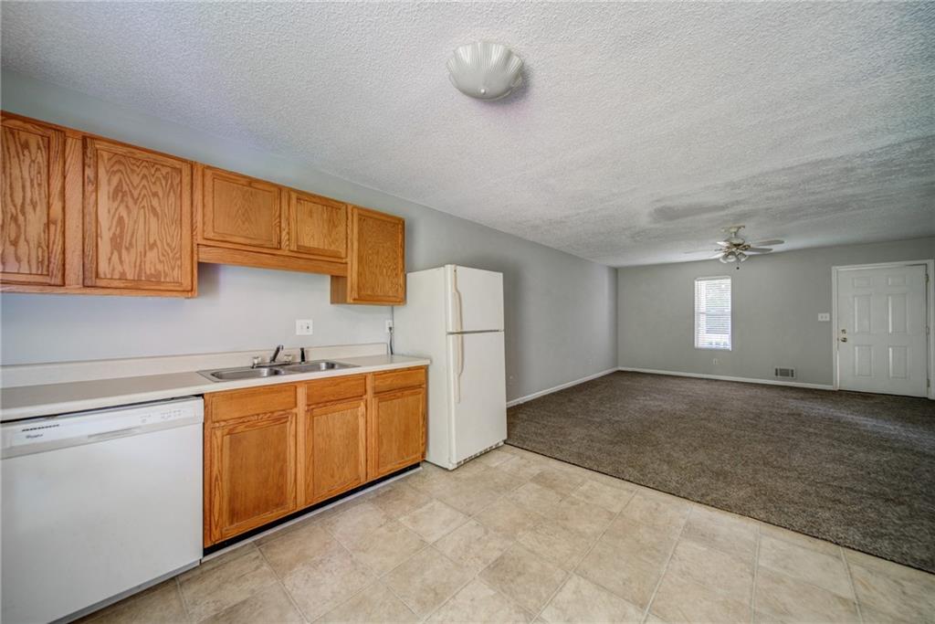 4355 East Paulding Drive, Unit A Dallas, GA 30157 - Photo 4 of 29 a view of a kitchen with white cabinets