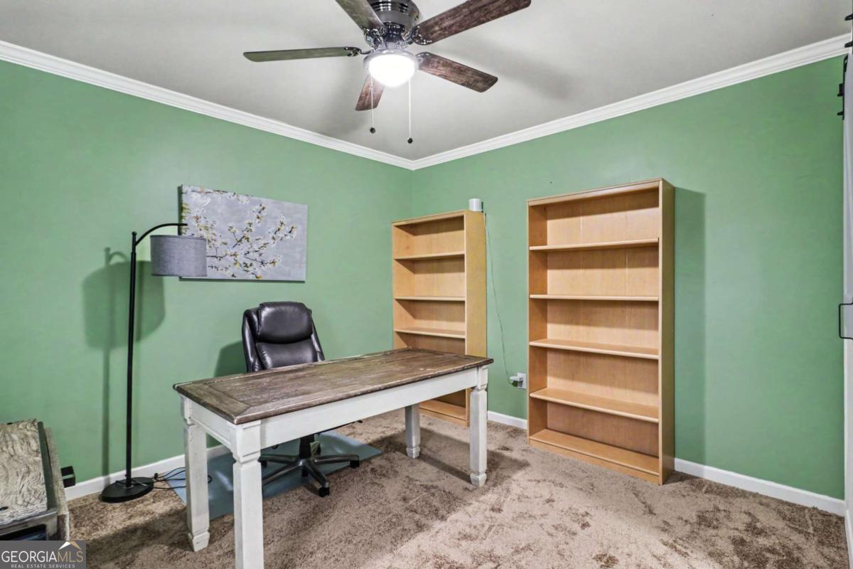 207 George Wynn Road Palmetto, GA 30268 - Photo 25 of 32 a view of a workspace with furniture and a window