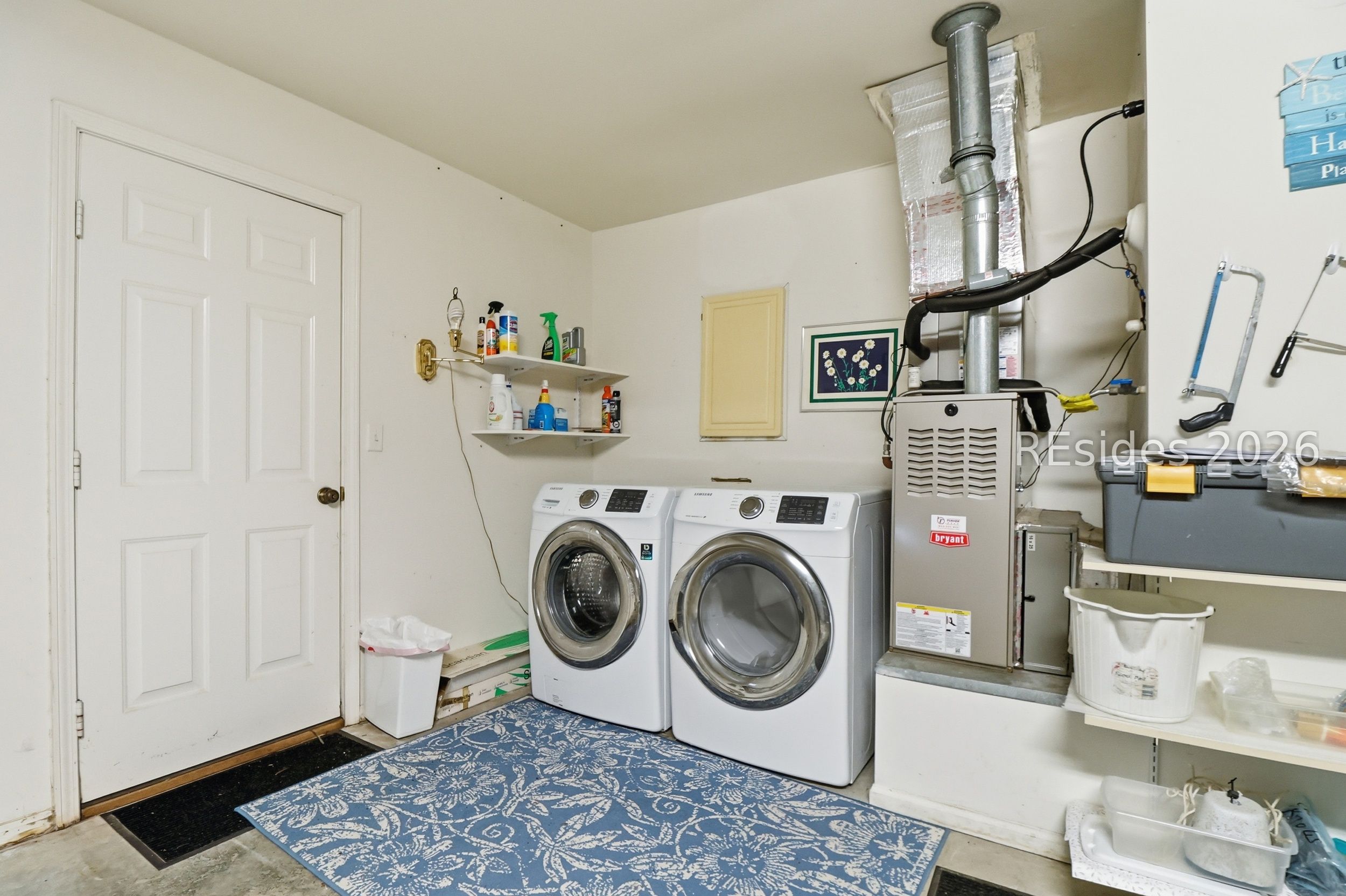 33 Broughton Circle Bluffton, SC 29909 - Photo 28 of 36 Garage laundry area with exterior generator access